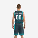 Opposite side view of charcoal and teal basketball uniform set showing hexagon fade hem pattern on jersey and shorts
