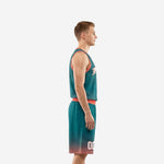 Front view of custom teal basketball uniform set with arched team name on chest, front number, and matching coral waistband shorts