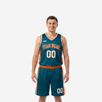 Custom teal basketball uniforms two-piece set with orange side panels, arced team name across chest, and matching shorts on male model - front view