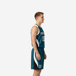 Front view of custom teal basketball uniform set showing white block team name, front number 00, and V-neck jersey with white armhole binding