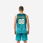Opposite side view of teal and gold sublimated basketball uniform set showing armhole binding detail and aqua gradient fade toward the shorts hem