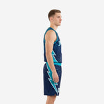 Front view of custom teal basketball uniforms on a male model wearing the navy and teal sublimated jersey and matching shorts with arched team name and number 00