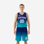 Custom teal basketball uniforms in a navy-to-teal gradient fade showing arched team name and front number on the sleeveless jersey and matching shorts