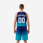 Opposite side view of custom navy and teal basketball uniforms displaying the clean armhole binding and gradient fade across jersey and shorts