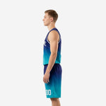 Side view of custom teal basketball uniforms showing the full navy-to-teal gradient fade on the jersey and matching shorts with player number on the leg