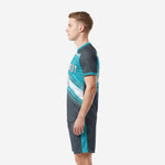 Custom teal soccer uniform set right side view showing full-dye gradient print across jersey and shorts on male model