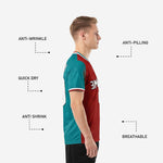 Detail of chest team name print zone on custom red soccer shirt with teal colorblock and white V-neck trim