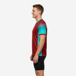 Custom teal soccer training jersey back detail showing full-dye sublimation player name arc and large back number on dark red fabric