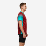 Custom teal soccer training jersey side view showing teal contrast side panel running from underarm to hem on dark red body