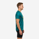 Custom green soccer training jersey left side view showing athletic cut and gold sleeve cuff trim on male model