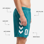Full-dye sublimation print detail on custom green soccer shorts with white geometric chevron graphic
