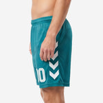 Custom green soccer shorts with white chevron panels and number 10 on right leg, side view showing full-dye sublimation print
