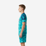 Custom teal soccer uniform kit side profile view showing navy contrast sleeves and crew neck collar trim