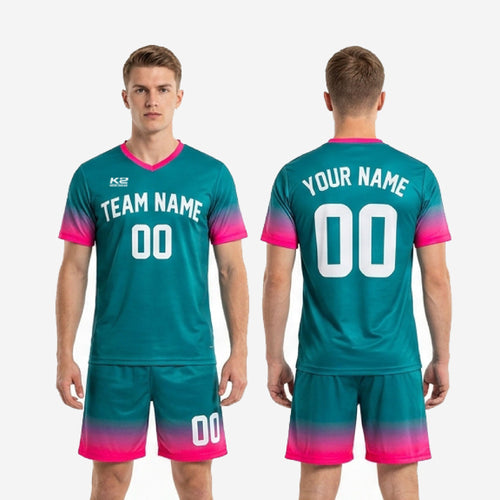 Custom teal and hot pink 2-piece soccer uniform set laid flat showing jersey and shorts together