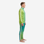 Custom teal soccer tracksuit left side view showing full gradient fade from lime green collar to teal ankle on male model