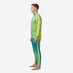 Custom teal soccer tracksuit right side view showing white sleeve and pant leg stripes against teal-to-lime-green gradient