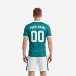 Close-up of V-neck and white trim detail on custom teal men soccer jersey