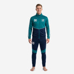 Custom teal soccer tracksuit front view showing teal jacket with navy blue pants and white stripe trim on adult male model