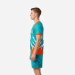 Custom teal soccer uniform right side view showing lightning bolt graphic and teal shorts with halftone sublimation detailing