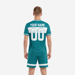 Custom teal soccer jersey and shorts kit with white contrast panel and player number on shorts leg