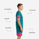 Custom teal soccer shorts with hot pink gradient fade at hem and sublimated player number on left leg