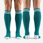 Full-length pair of custom teal soccer socks showing over the calf fit and white toe
