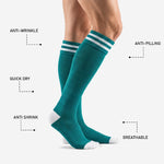 Custom teal soccer socks reinforced white heel and toe zone detail on male model