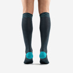 Custom teal soccer socks cuff detail featuring geometric diamond lattice print in teal on charcoal background
