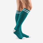 Custom teal soccer socks side profile showing over the calf length and white toe zone