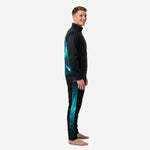 Custom teal soccer tracksuit side view showing galaxy gradient sleeve panel and teal stripe on tapered pants