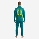 Teal full-zip stand-collar soccer jacket with chest number and team logo zones, neon yellow camo trim detail