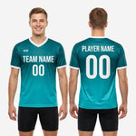 Full body view of custom teal soccer training jersey athletic cut on adult male model with gradient print edge to edge