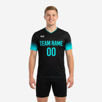 Close detail of teal-to-black gradient fade on the short sleeve of a custom soccer training jersey