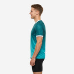 Custom teal soccer training jersey right side view showing athletic fit construction and teal gradient from shoulder to hem