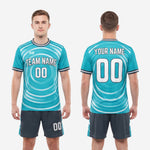 Full custom teal and charcoal soccer uniform set with sublimated jersey and matching shorts