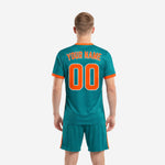 Custom teal soccer uniform set for men, jersey and matching shorts with orange contrast trim