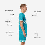 Custom teal soccer uniform shorts with geometric triangle hem band and player number on left leg