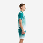 Men's custom teal-to-white gradient soccer uniform, side view showing V-neck jersey and matching shorts