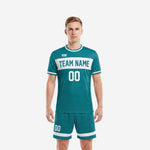 Men's custom teal soccer uniforms with white chest panel and matching teal shorts, front view