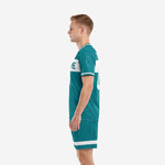Teal and white custom soccer kit side profile showing crew neckline and athletic cut jersey