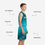 Back view of custom teal youth basketball uniform displaying sublimated dark teal hex gradient on jersey and matching shorts with teal hem accent