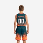 Opposite side view of youth sublimated basketball uniforms in teal with full flame print on jersey and shorts hem trim detail