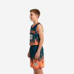Side view of teal and orange flame youth basketball uniform set showing V-neck jersey and elastic waistband shorts with drawcord