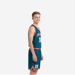 Front view of custom teal youth basketball uniform set with coral-orange V-neck binding side sweep panel and sublimated number 00 on jersey and shorts