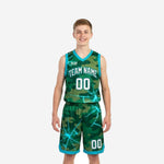 Custom teal youth basketball uniforms in green camo and electric teal lightning print, full 2-piece jersey and shorts set, front view