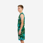 Second side view of teal youth basketball uniforms showing matching green camo shorts with teal hem binding and chevron accent