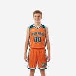 Custom teal youth basketball uniforms in orange and teal with arched team name, front number, and matching shorts - full set front and back view