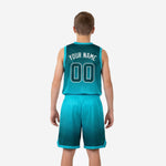 Opposite side view of custom teal youth basketball uniform set showing elastic waistband, drawcord shorts, and hex pattern gradient detail across the fabric
