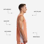 Back view of white and orange sublimated basketball jersey showing orange back panel with player name across shoulders and back number centered