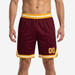 Custom team basketball shorts maroon and gold right side view showing athletic cut mid-thigh length and elastic drawcord waistband